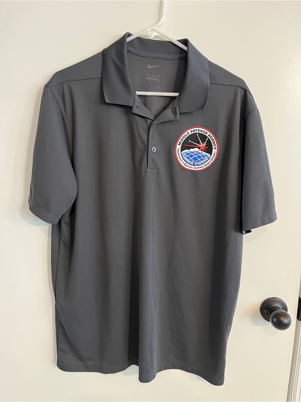 Men’s size large Nike Missile Defense Agency polo small pin holes from tags
